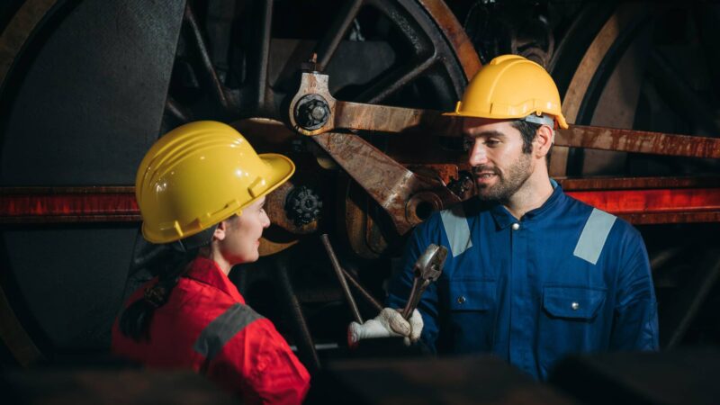 Industrial engineers inspect and perform maintenance on the machines at factory machines. Efficient Machinery Operation and Teamwork in the Manufacturing Industry Industrial engineers inspect and perform maintenance on the machines at factory machines. Efficient Machinery Operation and Teamwork in the Manufacturing Industry